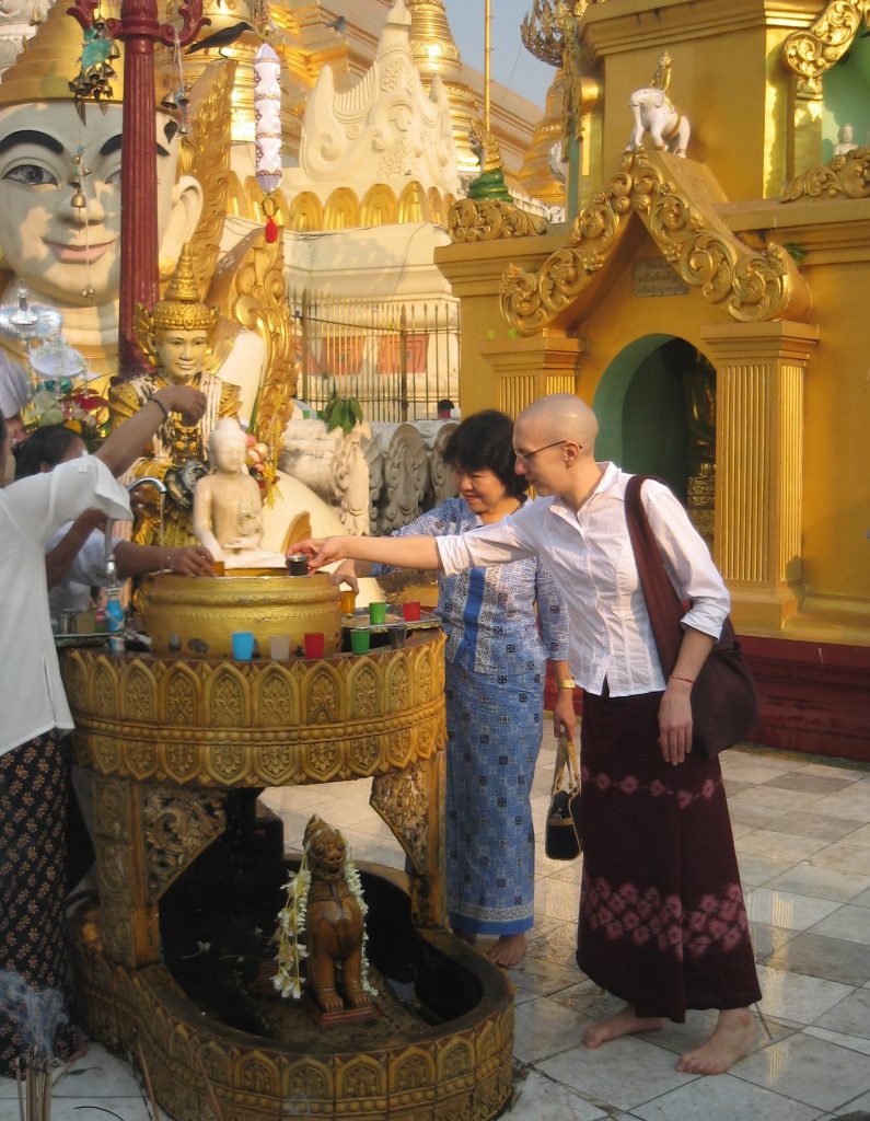 In 2007, I traveled to Burma to ordain as a Buddhist nun and practice intensively in a monastery. In this photo, from the day after I took off my robes, I’m making an offering at the Shwedagon Pagoda.